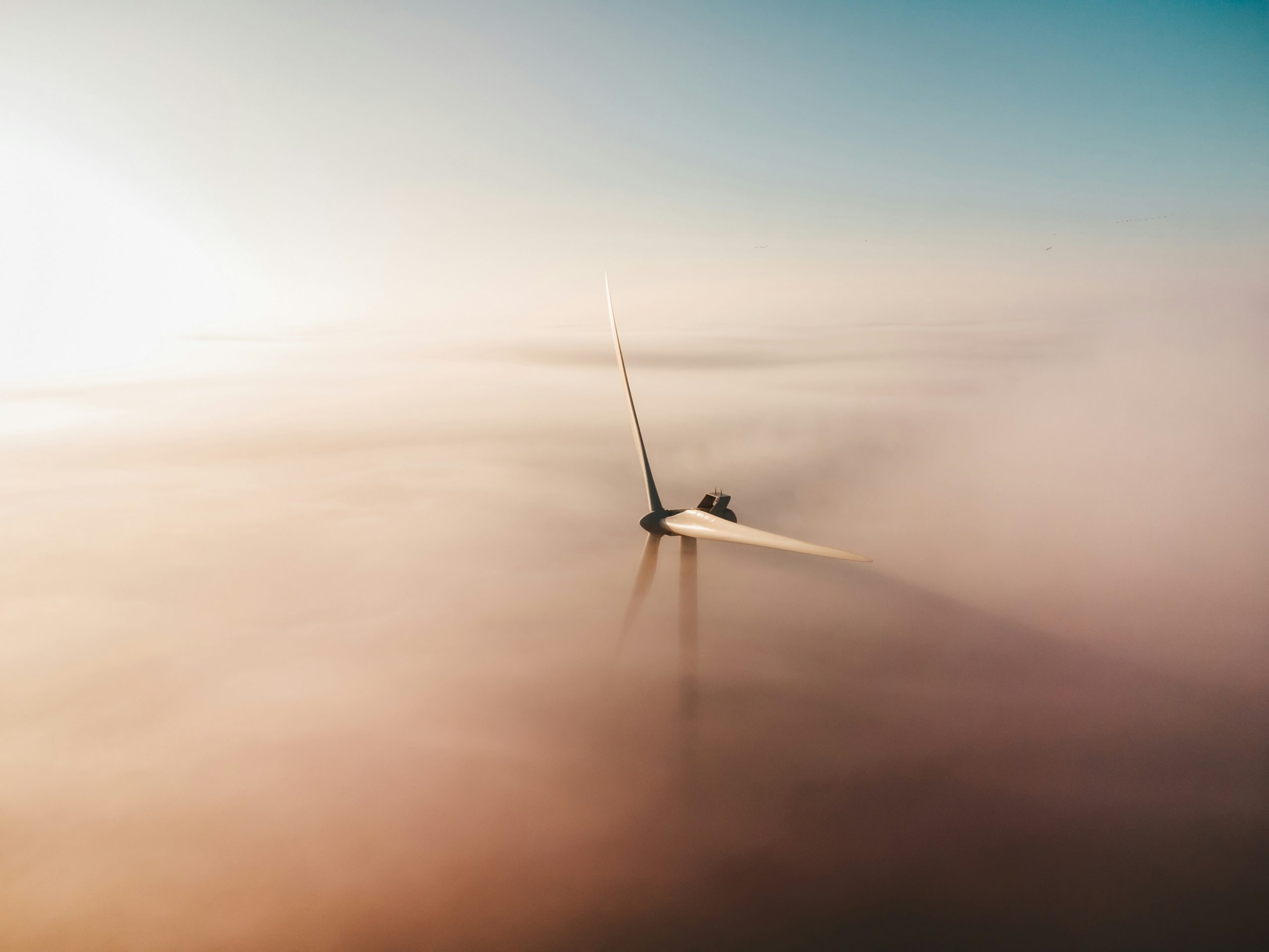 Early morning windmill sunrise in the mist.